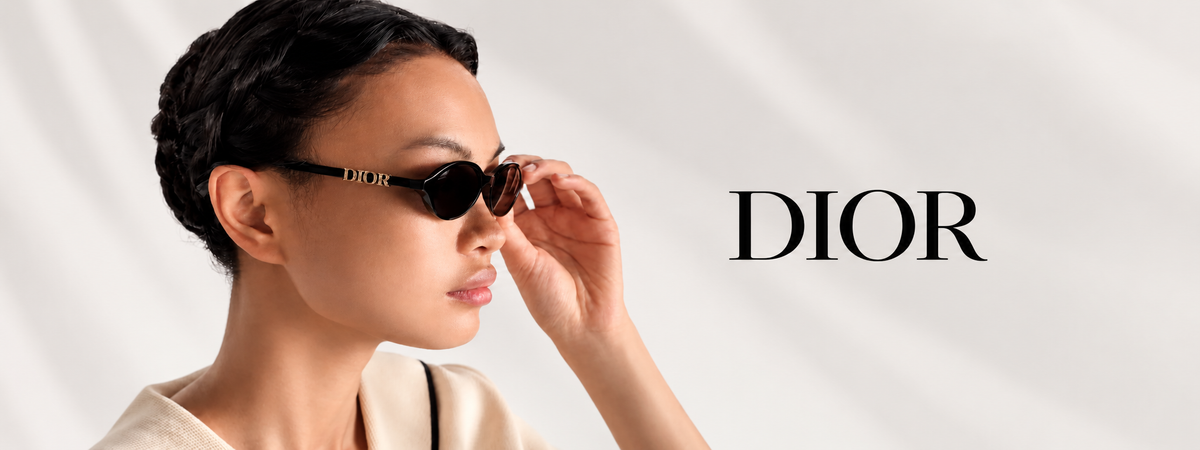 A woman in profile wearing Dior sunglasses, with the Dior logo printed on the right side of a light draped background.
